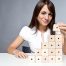 Person Stacking Wooden Blocks